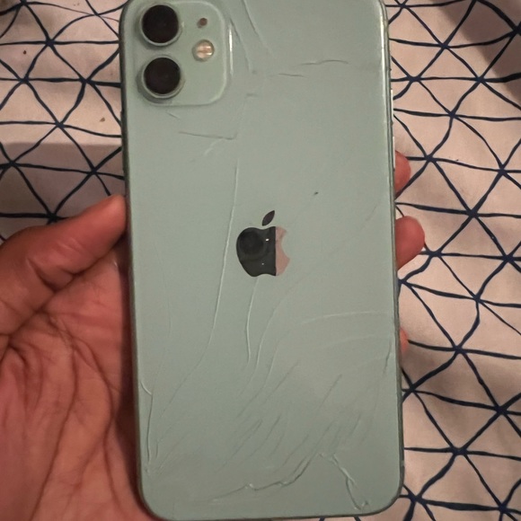 iPhone 11 , it has A cracked back , volume Low but It’s Unlocked Work Real Good